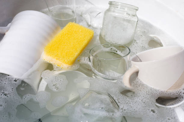 istock Washing used drinking glasses and cups 1529490430
