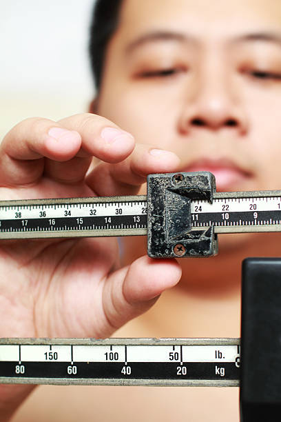 istock A person measuring an object close up 152949792