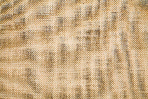 A tan burlap textile background can you be used for a sack