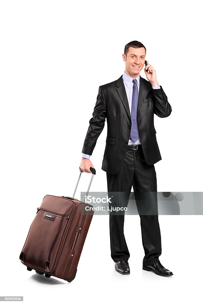 Viaggiatori d'affari che porta una valigia e parla al telefono - Foto stock royalty-free di Businessman