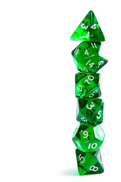 A set of translucent dices stacked into a pile and isolated on a white background. This sort of dices a most commonly used in role-playing games.