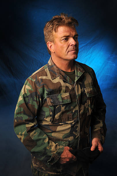 istock British army officer in combats hold his beret 152951517