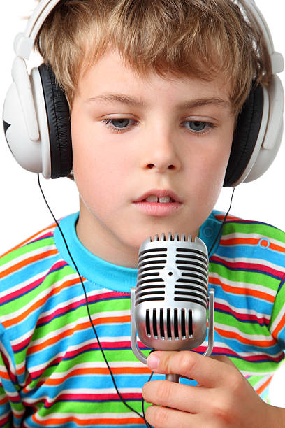 istock Boy in headphone with microphone opened slightly mouth 152952501