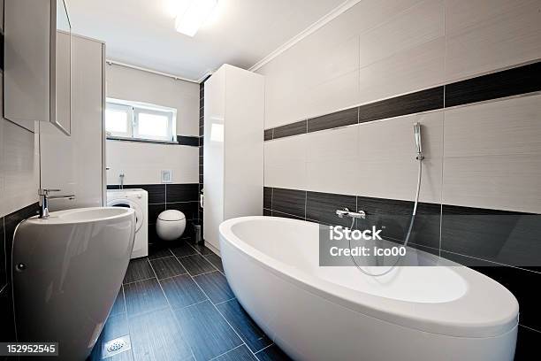 Modern Bathroom With Black Tiles Stock Photo - Download Image Now - Bathroom, Bathtub, Flooring