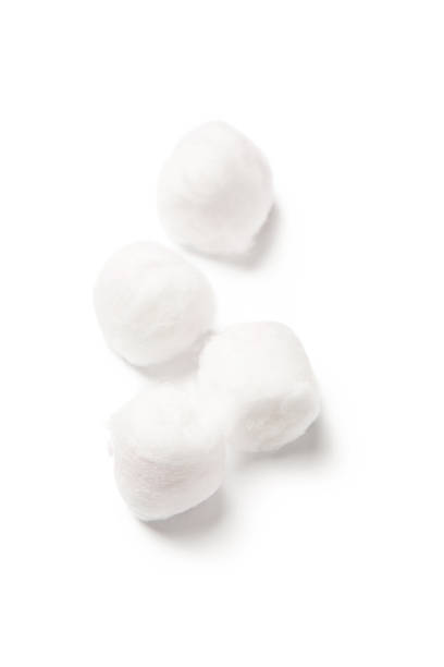 Four white cotton balls on a white background Cotton balls isolated on white cotton ball photos stock pictures, royalty-free photos & images