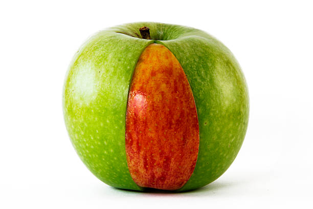 istock green apple with red slice inside of it 152952836