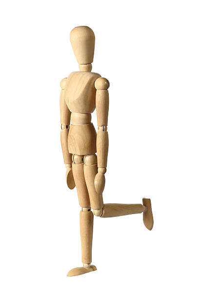 istock Wooden Figure Standing On One Leg 152953560