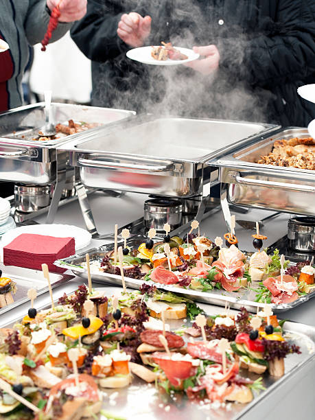 istock People choosing food from buffet 152953951