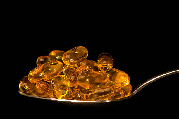 istock Spoon full of medical capsules 152954020