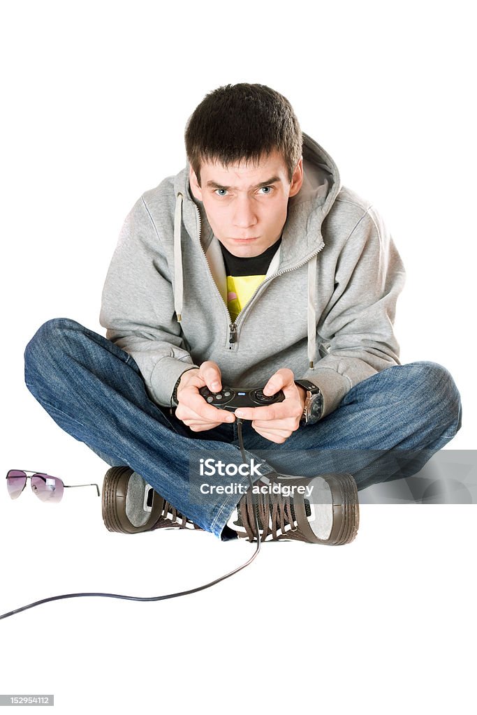 Giovane uomo con joystick per videogiochi console. Isolato - Foto stock royalty-free di Console - Attrezzatura elettronica