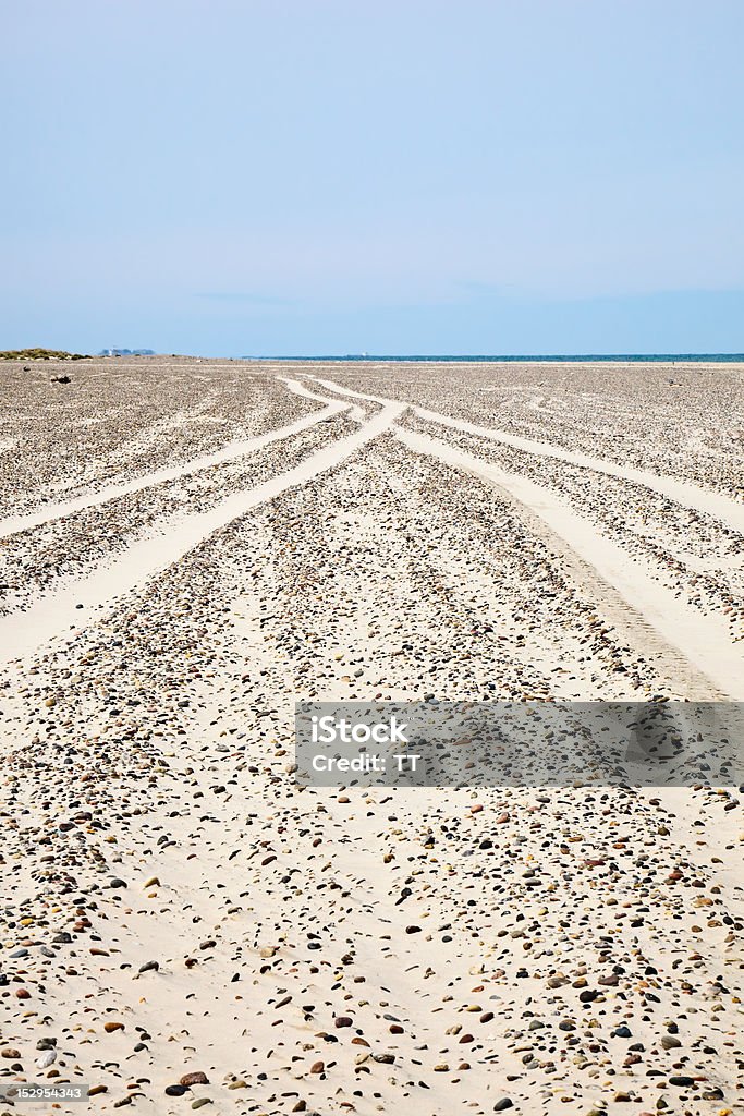 Car tracks Car tracks in the sand at the beach Beach Stock Photo