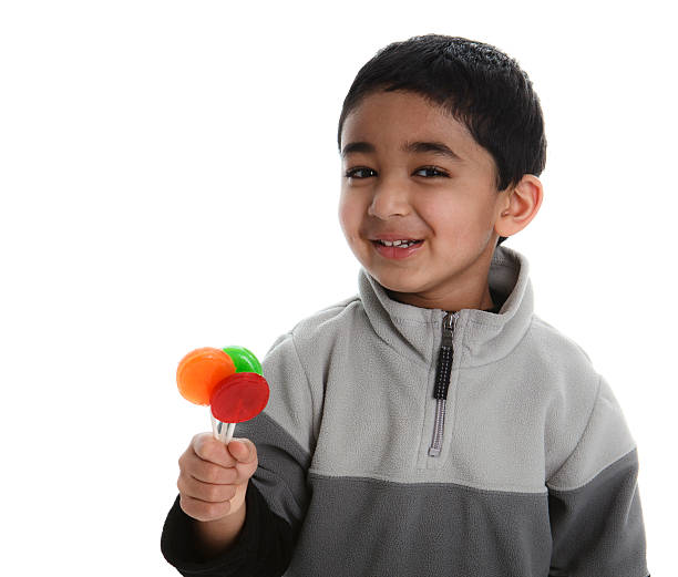 istock Happy Child with Three Colorful Lollipops 152954913