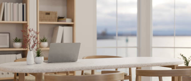 istock A beautiful minimalist Scandinavian dining room with a laptop on a dining table. close-up image. 1529551983