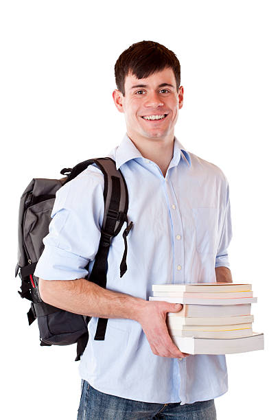 Happy, smiling, handsome male student with books and school bag stock photo