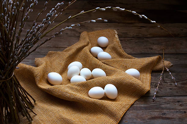 istock Bunch of willow and white eggs on the sack fabric 152956515