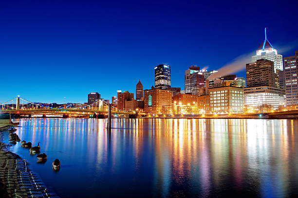 Pittsburgh skyline reflecting in Allegheny River stock photo