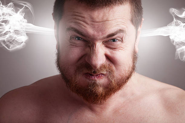 Stress concept - angry man with exploding head stock photo