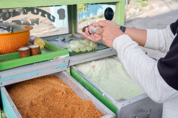 istock making a traditional Indonesian cake putu 1529578619