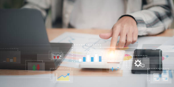 istock statistical analyst reading graph report and business statistics charts ,Analysis and improvement of corporate strategy ,manage financial and marketing documents , Statistics and Data Concepts 1529581763