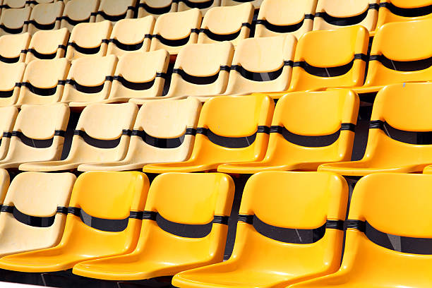istock old and new yellow seat in stadium 152958364