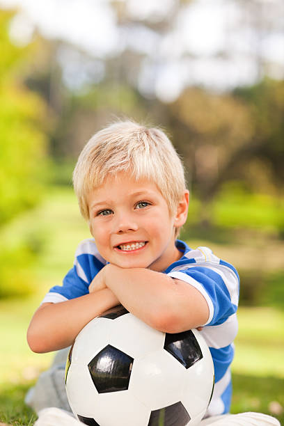 istock Boy with his ball in the park 152958424