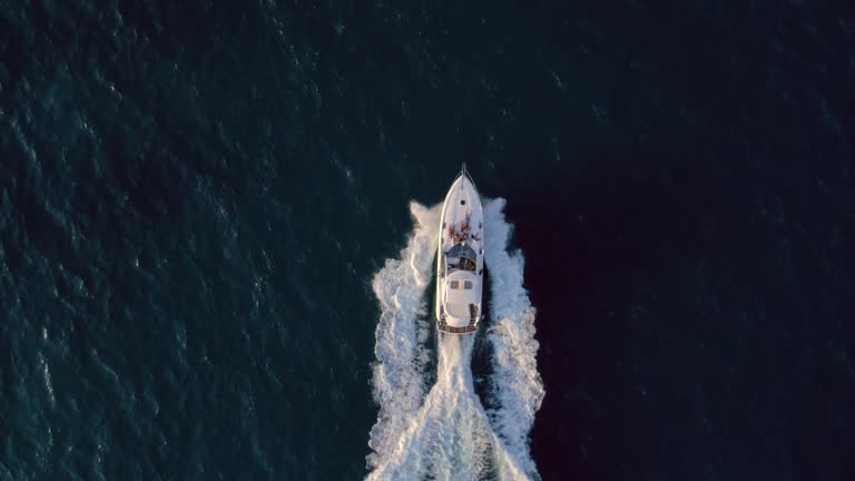 Aerial drone shot of a yacht with party on board