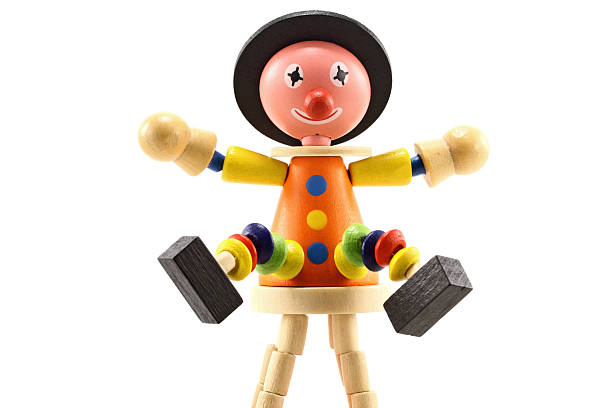 Cheerful wooden clown toy isolated on white background.