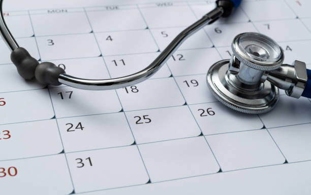 Stethoscope and pen on a calendar