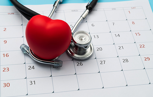 Stethoscope and heart shape on a calendar.