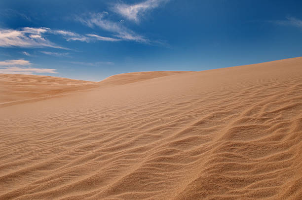 Sand Dune and Blue Sky stock photo