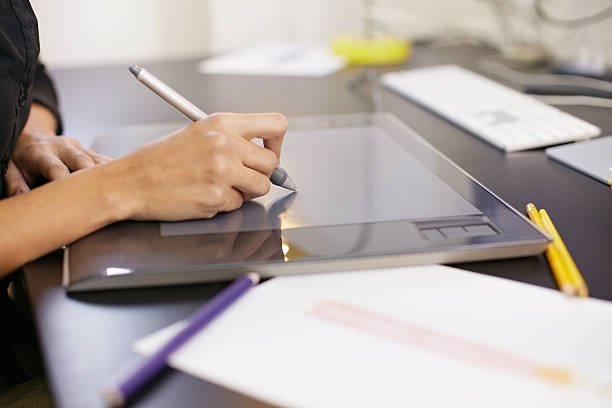 istock Woman drawing sketches on computer in fashion design studio 152959253
