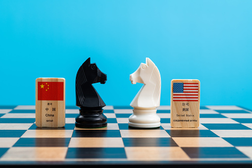 Chessboard with Chinese and USA flags.