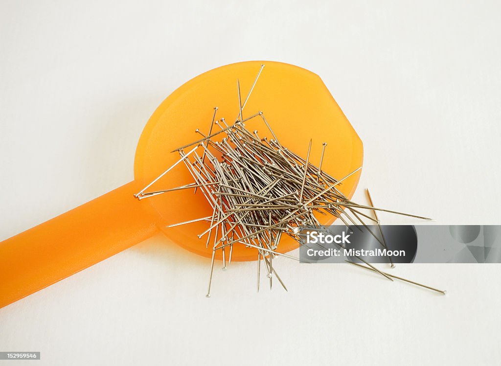 Pins Pins in plastic spoon Danger Stock Photo