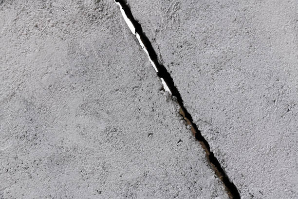 Gray concrete wall with crack
