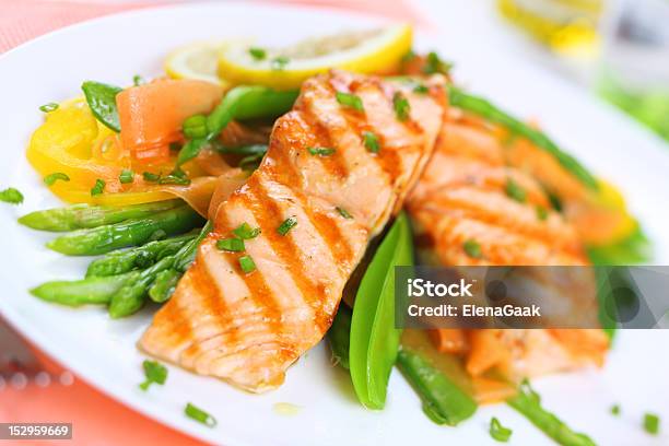 Grilled Salmon With Spring Vegetables On White Plate Soft Focus Stock Photo - Download Image Now