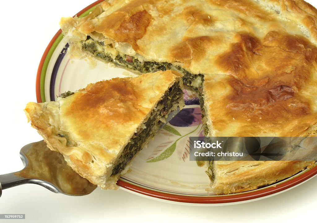 Spinach pie Spinach and bacon pie on a white background Edible Mushroom Stock Photo