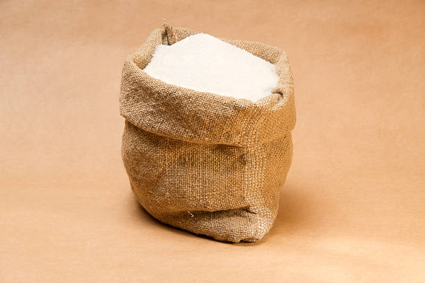 istock Burlap sack full of granulated sugar 152959910