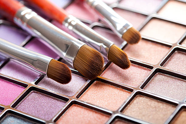 Eye shadows palette and professional brushes stock photo