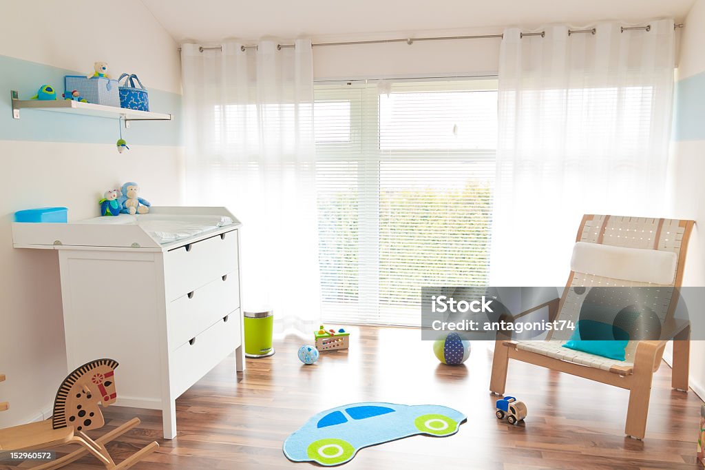 Children's Playroom modern children's playroom with baby changing table Rocking Chair Stock Photo