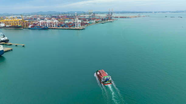 istock cargo container ship sailing full speed in sea to import export goods and distributing products to dealer and consumers across worldwide, by container ship Transport open sea. aerial view 1529607397