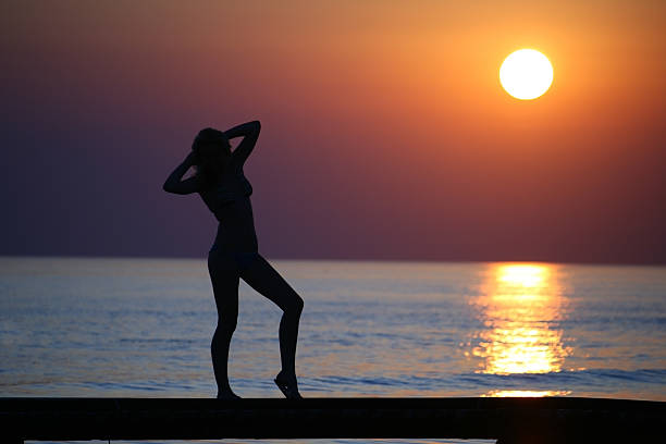 istock Girl on bridge against sunset. 152960898