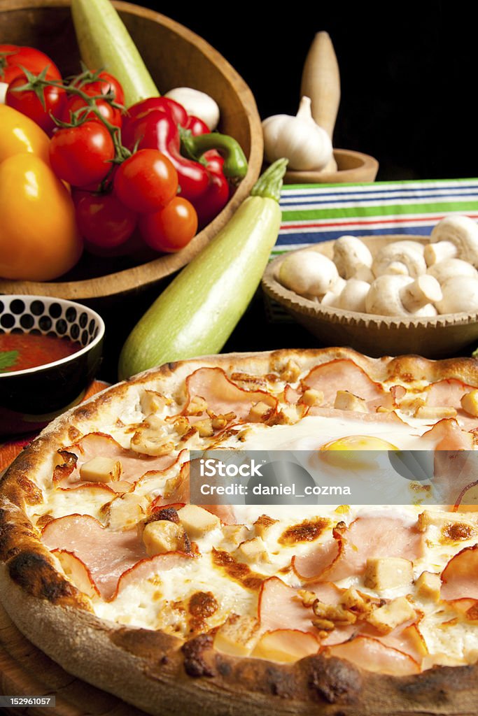 Tasty Pizza Tasty pizza with fried egg in the middle Baked Stock Photo