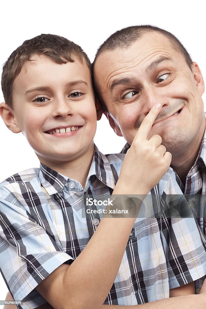 Father and son making funny faces Cute kid and his dad making funny faces, isolated on white background Father Stock Photo