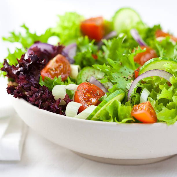 istock Closeup of vegetable salad on white background 152962091