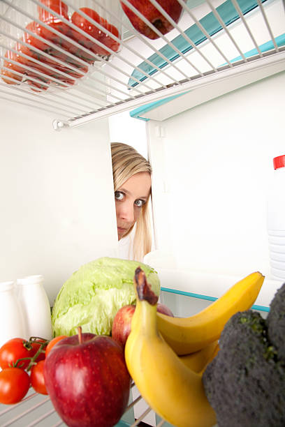 istock Woman looking in refrigerator 152963563