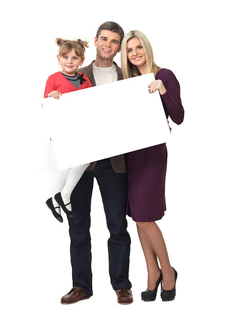 istock Smiling family holding your message 152963847