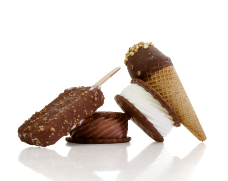 Yummy, chilly ice cream treats reflected on a crisp white background