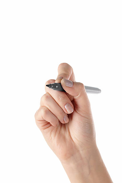 istock Writing. Marker in female hand (isolated) 152964438