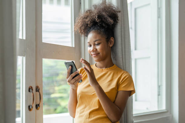 istock Happy woman relaxing comfortable , enjoying web surfing information in internet or using mobile software application, communicating distantly with friends in social networks at home 1529647405