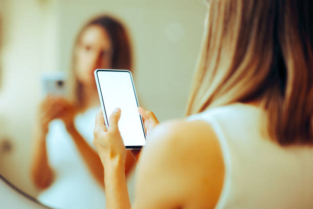 istock Unrecognizable Person Holding a Blank Phone Display for Mock up 1529648856